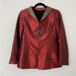 Rich burgundy top with knots decorated closure and contrast collar.